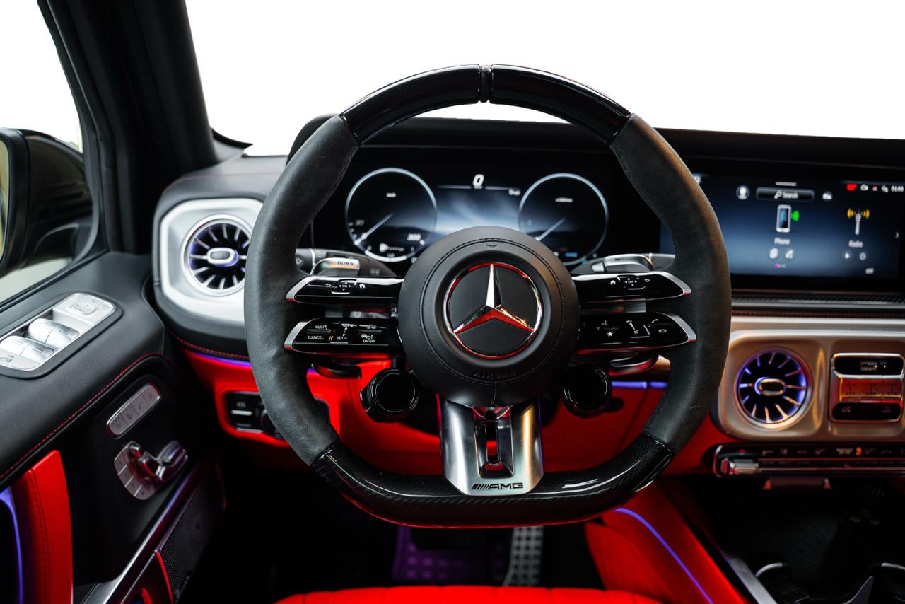 Custom Mercedes G63 AMG Manufaktur parked inside luxury Dubai vehicle showroom