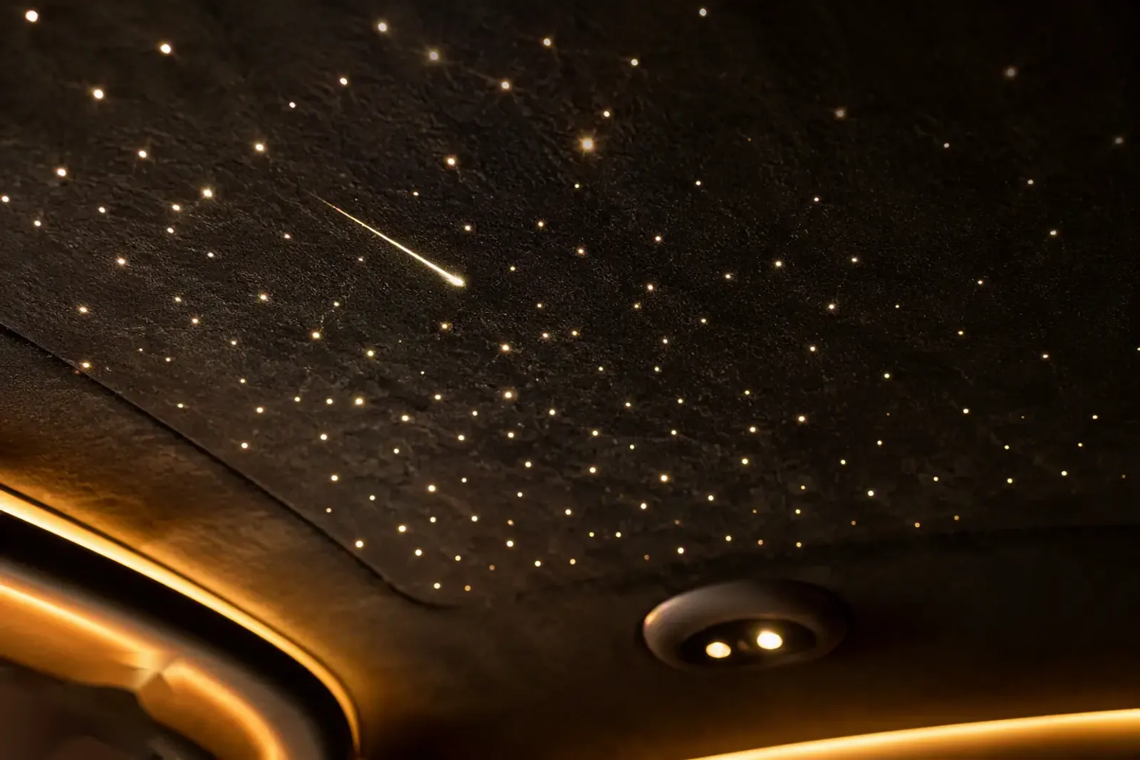 Alcantara starlight headliner glowing warm white in a Barugzai VIP conversion
