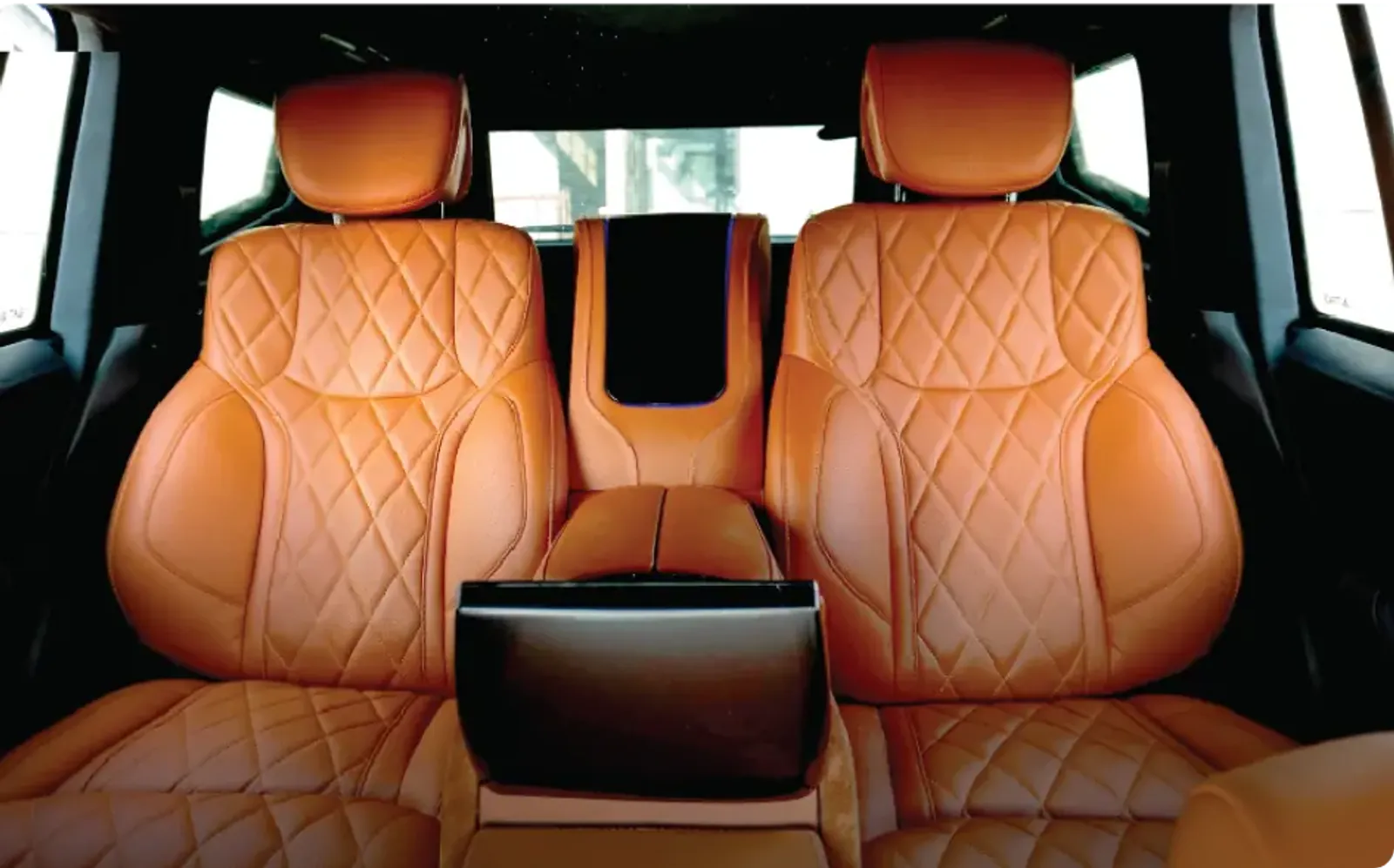 Diamond-stitched VIP seats in a custom SUV by Barugzai